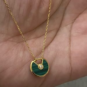 Amulette de Cartier Necklace xs model 18k gold750/1000 malachite with diamond.